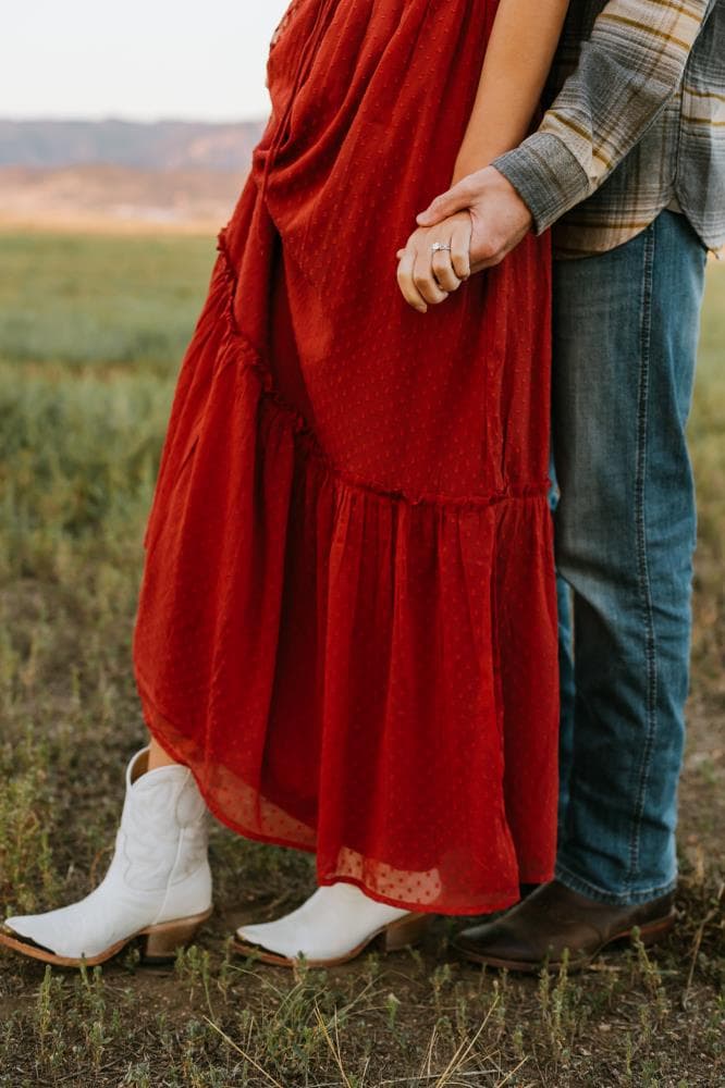 Couple embracing at sunset engagement photos Front Range Colorado