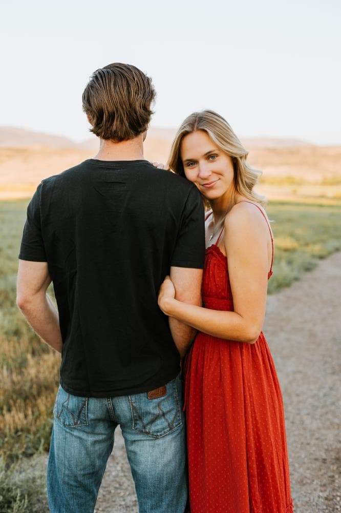 Couple embracing at sunset engagement photos Front Range Colorado