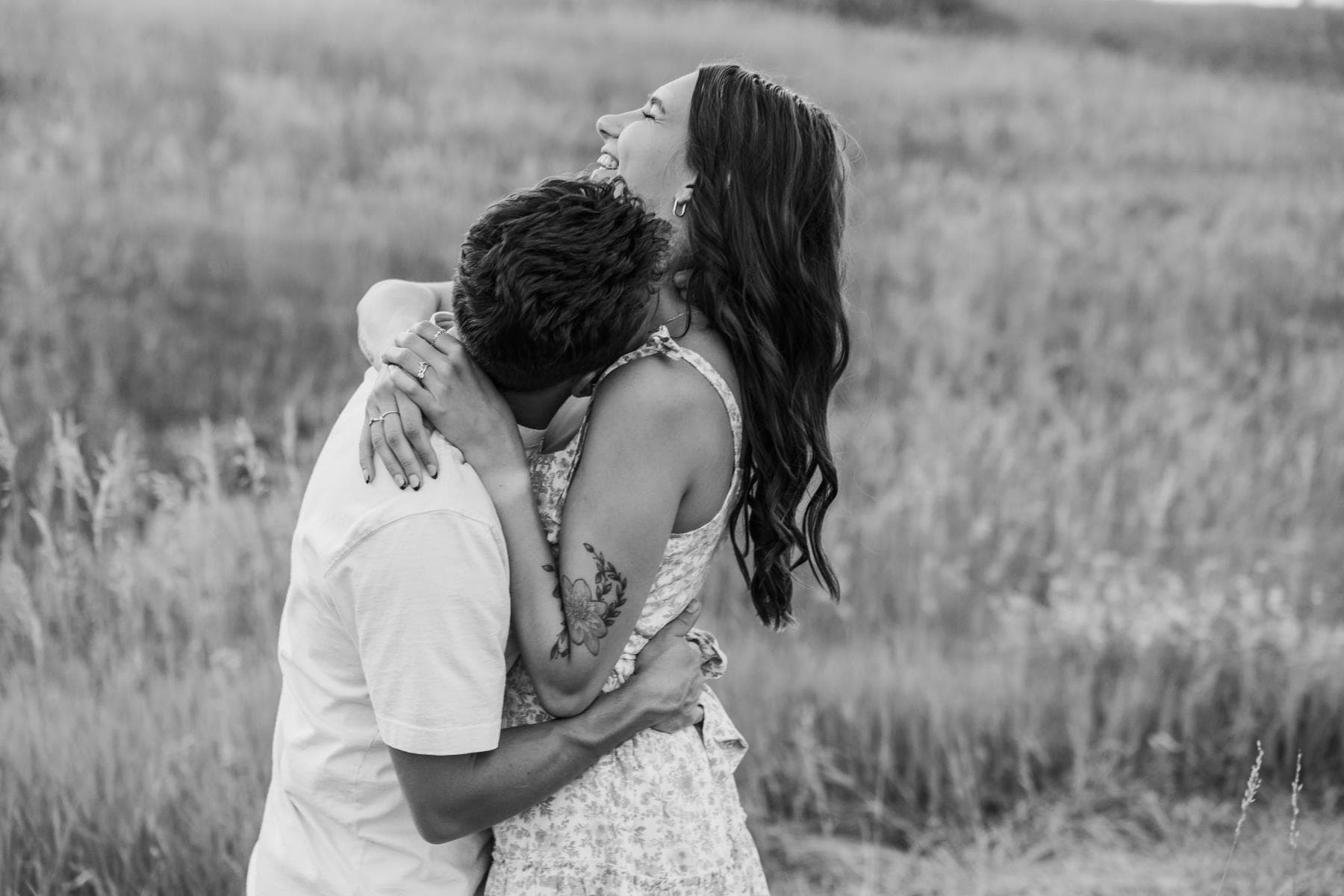 Couple embracing at sunset engagement photos Front Range Colorado
