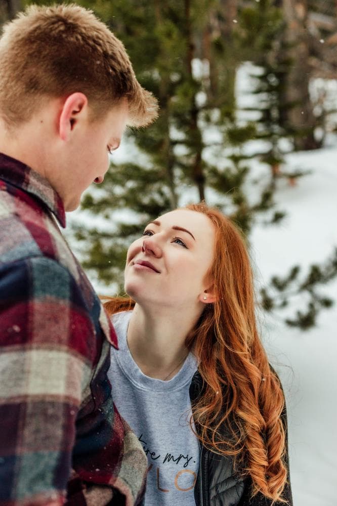 Couple embracing at sunset engagement photos Front Range Colorado