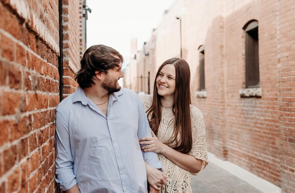 Couple embracing at sunset engagement photos Front Range Colorado