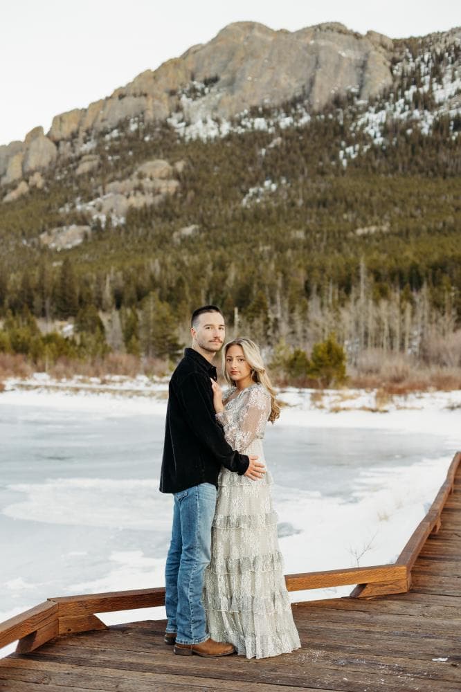Couple laughing together golden hour engagement session Northern Colorado