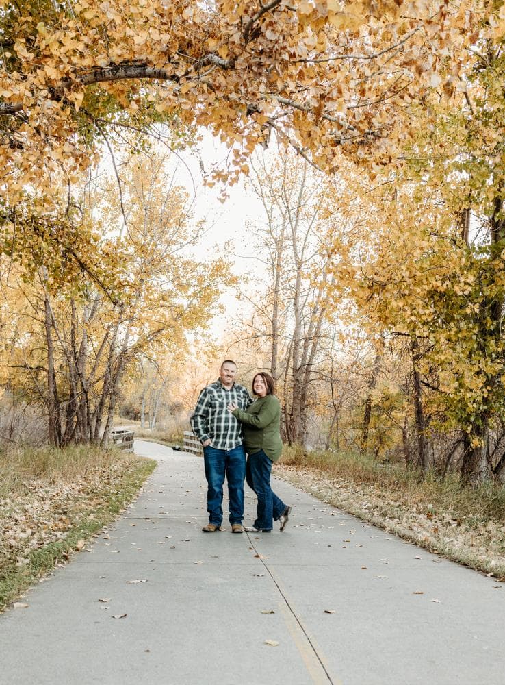 Couple embracing at sunset engagement photos Front Range Colorado