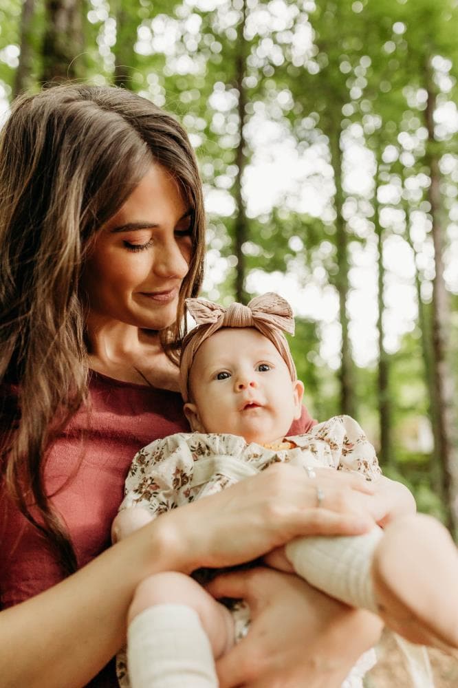 Family of four hugging outdoor portrait session Windsor Colorado