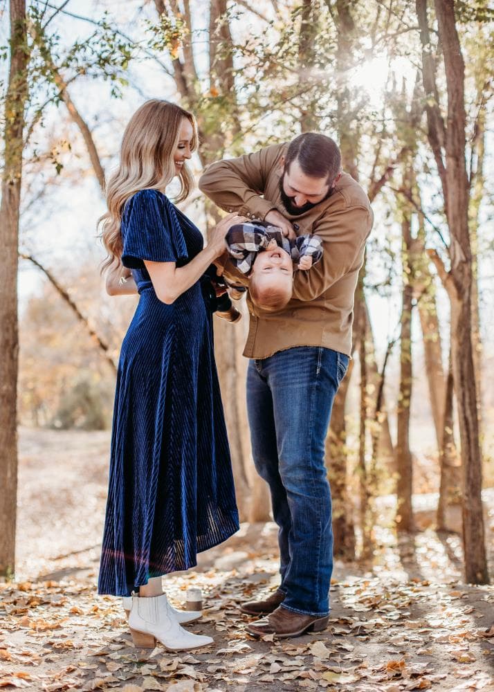 Family of four hugging outdoor portrait session Windsor Colorado