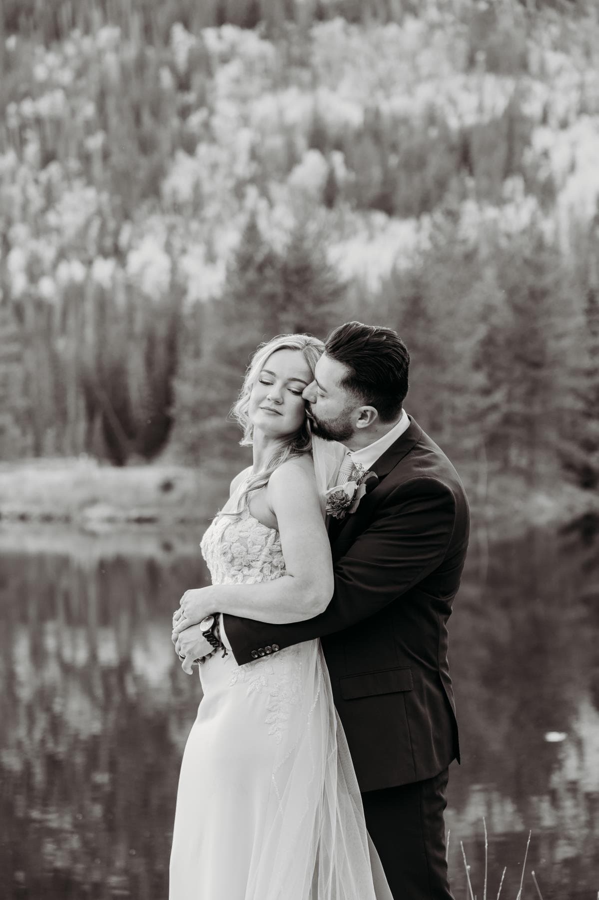 Newlyweds walking hand in hand at sunset Estes Park Colorado