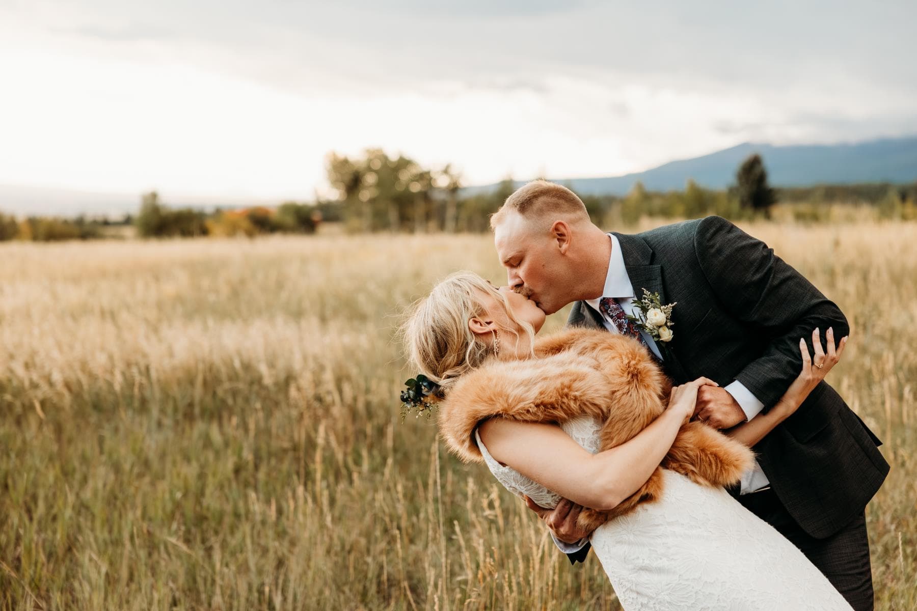 Bride walking down aisle surrounded by guests Northern Colorado wedding